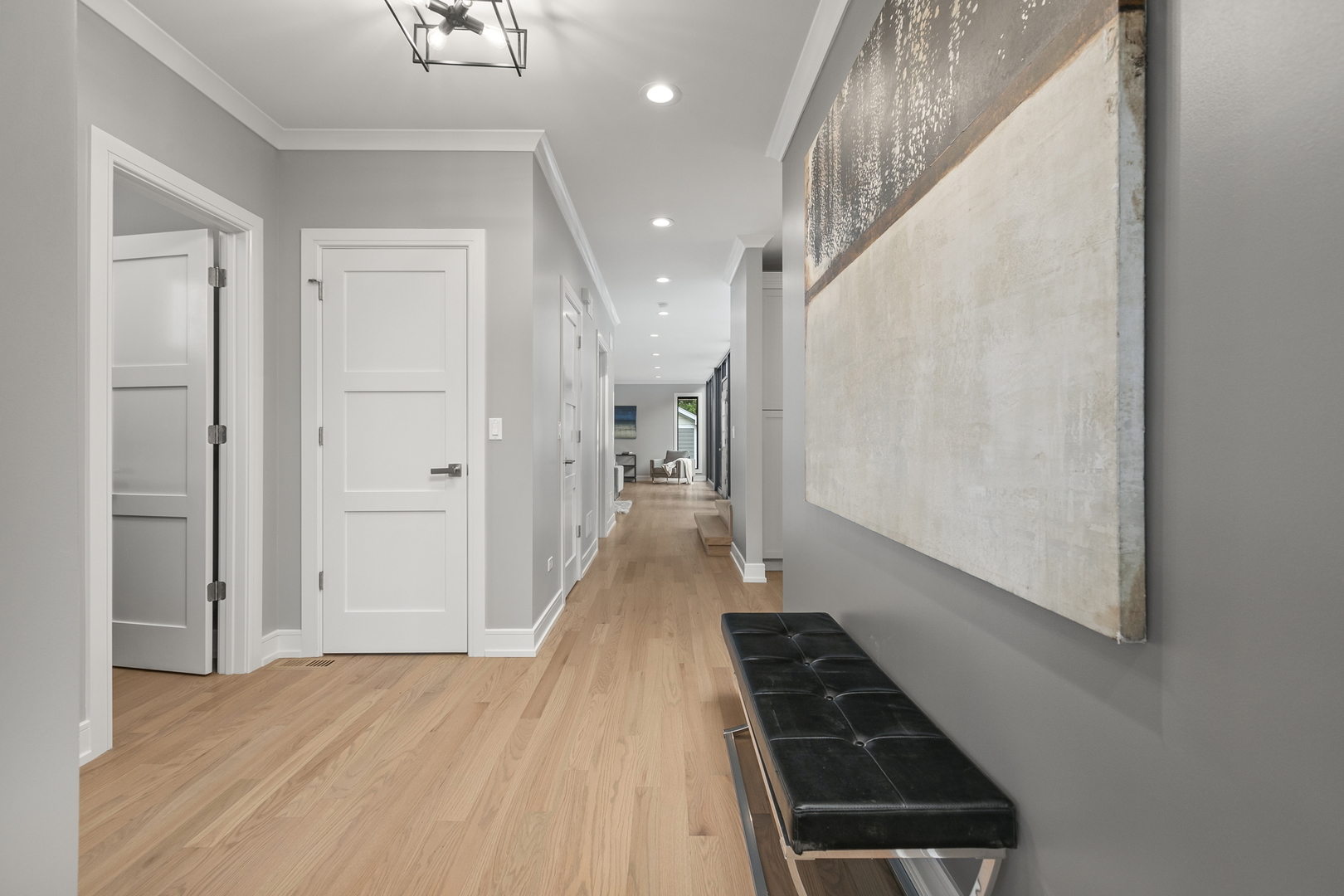 220 Spring Avenue Naperville, IL 60540 - Photo 3 of 52 a hallway view with wooden floor and staircase