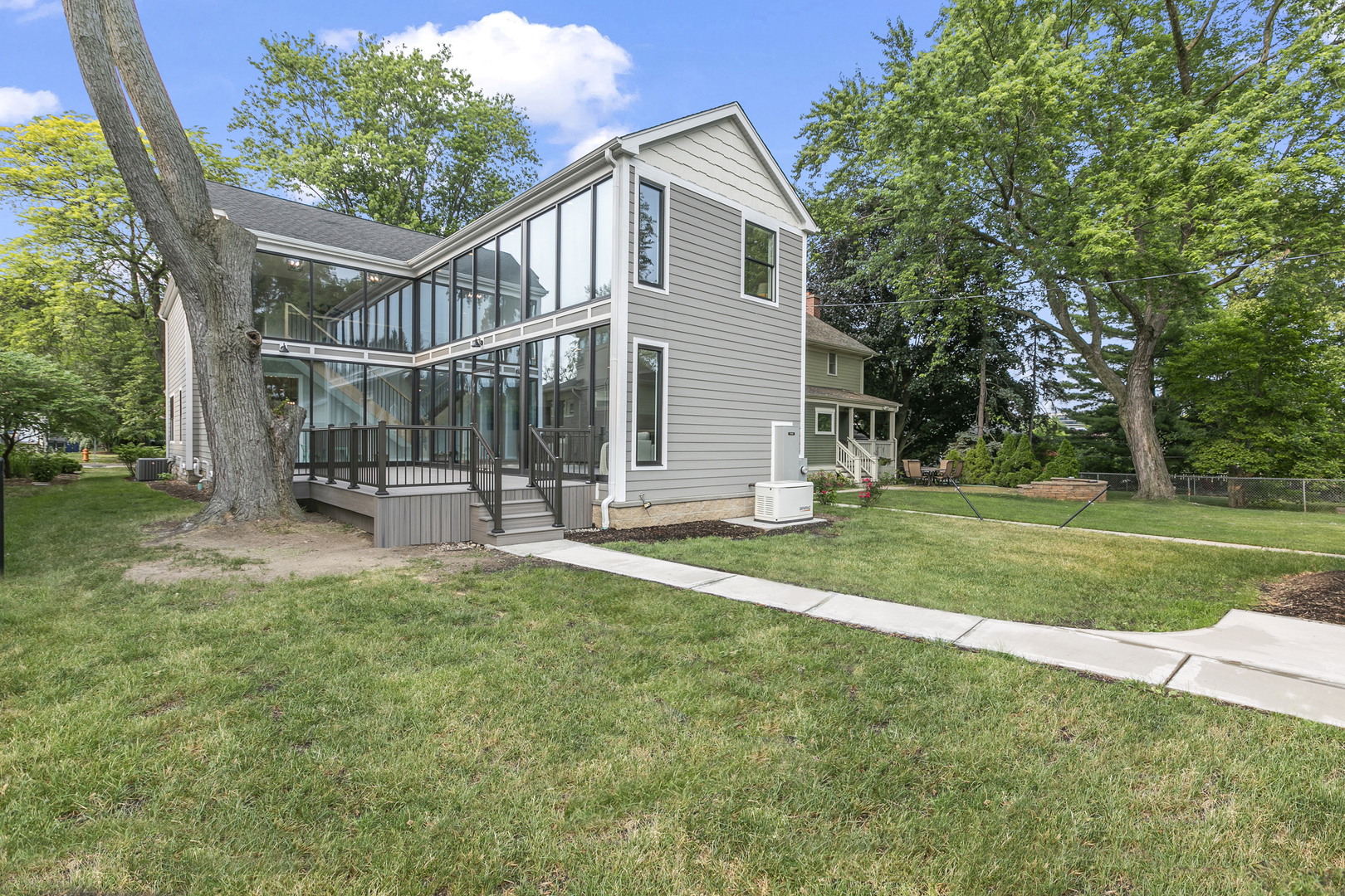 220 Spring Avenue Naperville, IL 60540 - Photo 49 of 52 front view of a house with a yard