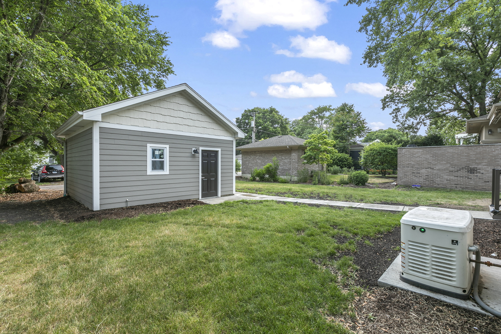 220 Spring Avenue Naperville, IL 60540 - Photo 50 of 52 a view of a house with a yard