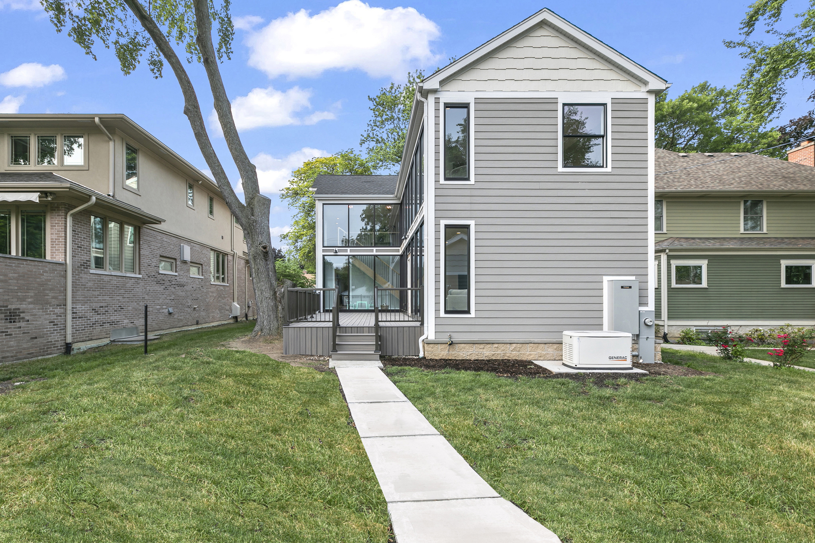220 Spring Avenue Naperville, IL 60540 - Photo 51 of 52 a front view of a house with a yard