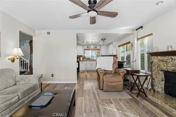 a living room with furniture and a fireplace