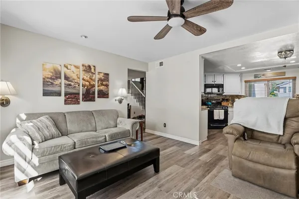 a living room with furniture and windows