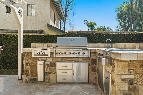 a view of a patio with table and chairs