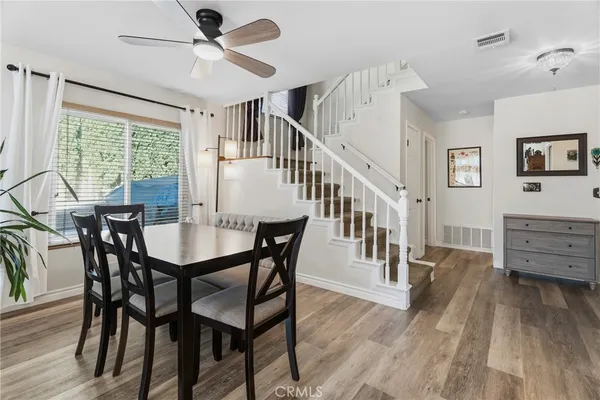 a view of a dining room with furniture window and wooden floor
