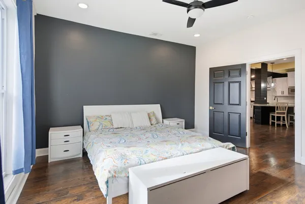 a bed room with a bed and a television