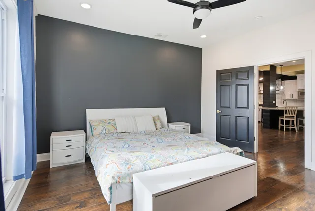 a bed room with a bed and a television