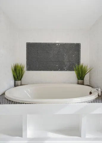 a bedroom with bed and a window