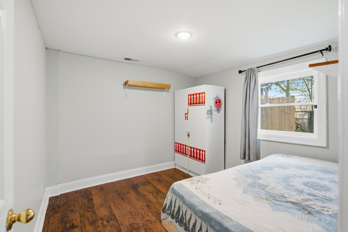 107 East Ward Street Centerville, TN 37033 - Photo 20 of 34 a bedroom with bed and a window