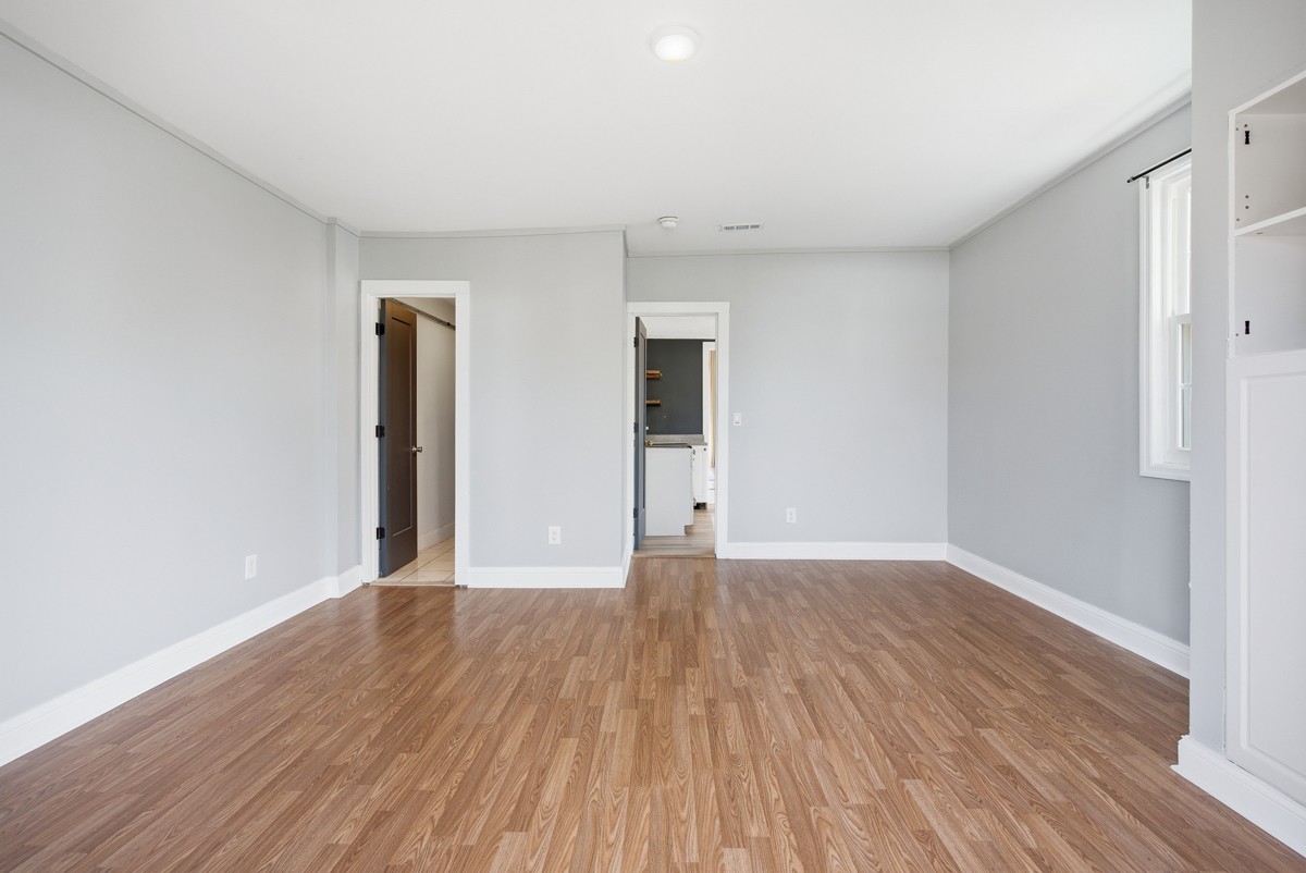 107 East Ward Street Centerville, TN 37033 - Photo 27 of 34 a view of an empty room with wooden floor