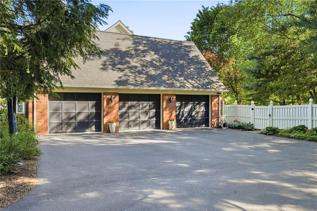 900 Settlers Ridge Road Pittsburgh, PA 15238 - Photo 3 of 50 3-car garage with additional space for storage, bikes, and a workshop. One-level access to the mudroom/laundry room and kitchen simplifies daily routines.