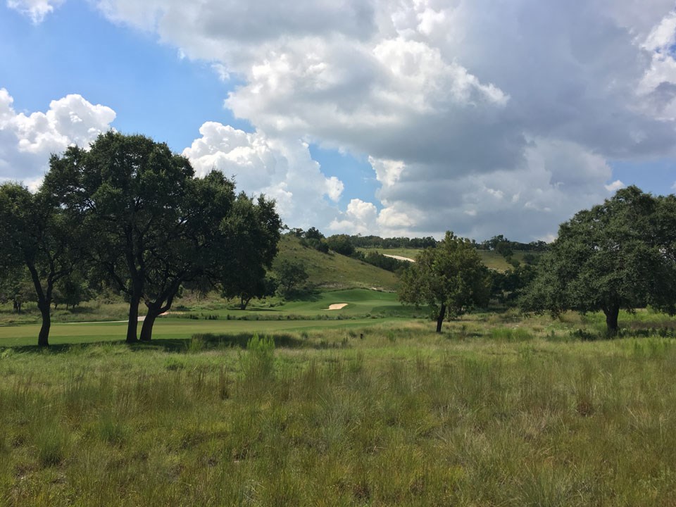 72 Boot Ranch Circle, Unit 72 Fredericksburg, TX 78624 - Photo 5 of 5 a view of outdoor space with green field and trees all around