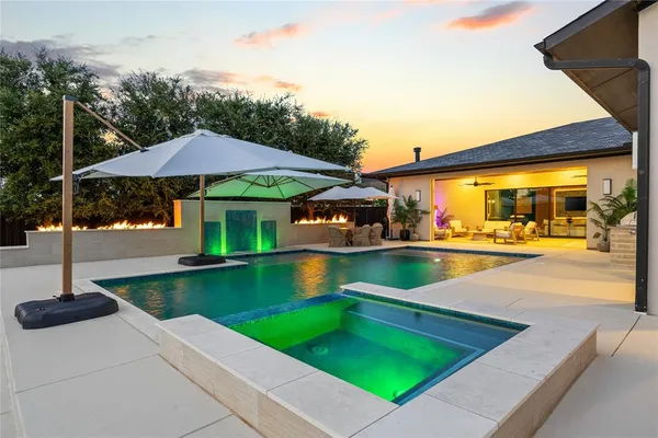 a view of a swimming pool with a patio