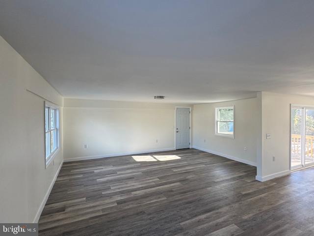 10 Loockerman Court Dover, DE 19901 - Photo 12 of 15 an empty room with wooden floor and windows