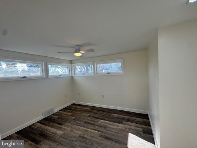 10 Loockerman Court Dover, DE 19901 - Photo 14 of 15 an empty room with wooden floor and windows