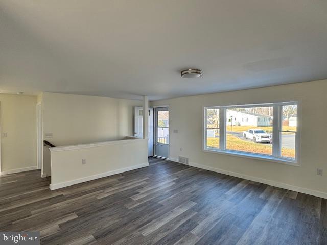 10 Loockerman Court Dover, DE 19901 - Photo 5 of 15 an empty room with wooden floor and windows