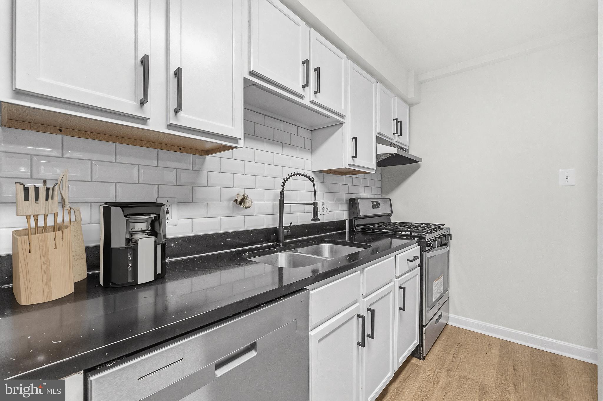635 Waterloo Road, Unit 222 Warrenton, VA 20186 - Photo 14 of 28 a kitchen with stainless steel appliances granite countertop a sink stove and cabinets
