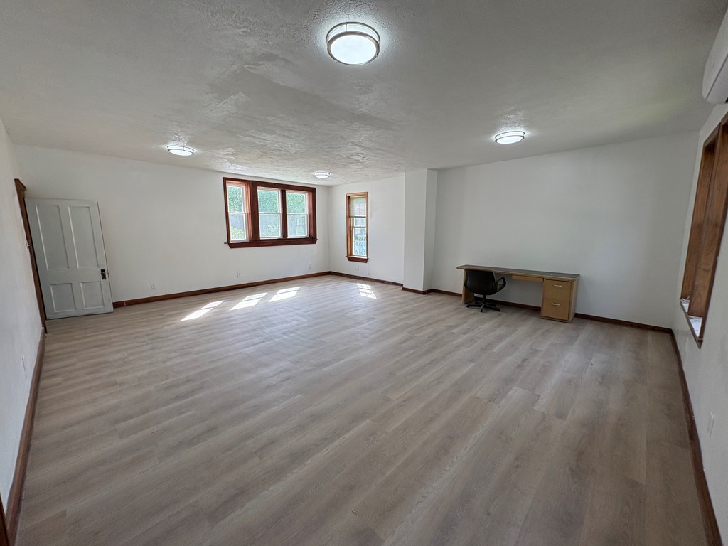 1828 Allegheny Boulevard Reno, PA 16343 - Photo 6 of 24 an empty room with wooden floor and a window