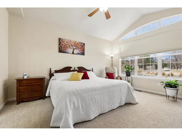 a bedroom with a bed and a chair