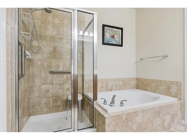 a living room with a bed furniture and a flat screen tv