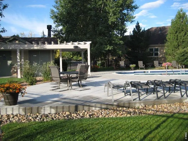 a view of a house with floor to ceiling windows and a basket ball poll