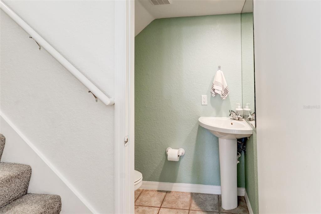 4004 Foxtail Palm Court, Unit 4004 Tampa, FL 33624 - Photo 14 of 49 a bathroom with a sink and mirror