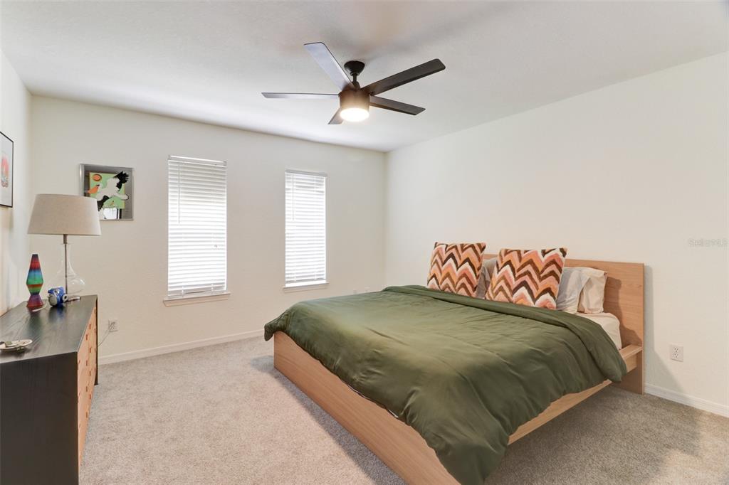 4004 Foxtail Palm Court, Unit 4004 Tampa, FL 33624 - Photo 16 of 49 a bedroom with a bed and window