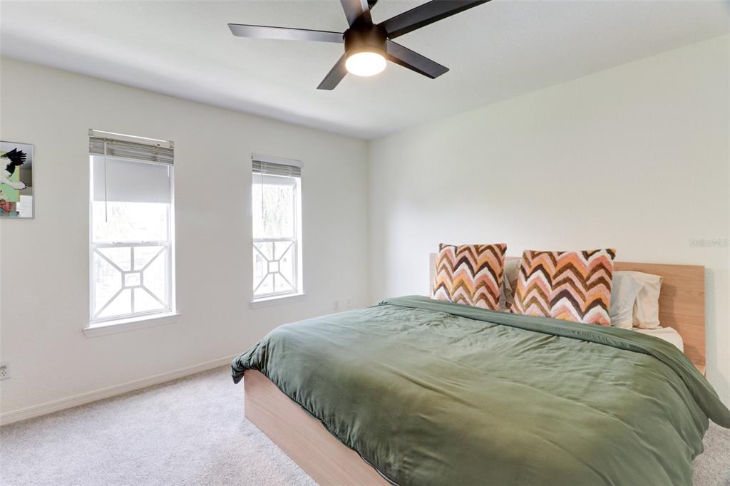 4004 Foxtail Palm Court, Unit 4004 Tampa, FL 33624 - Photo 22 of 49 a bedroom with a bed and window