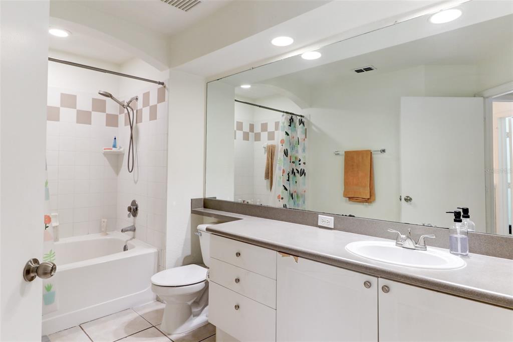 4004 Foxtail Palm Court, Unit 4004 Tampa, FL 33624 - Photo 24 of 49 a bathroom with a sink toilet tub and shower