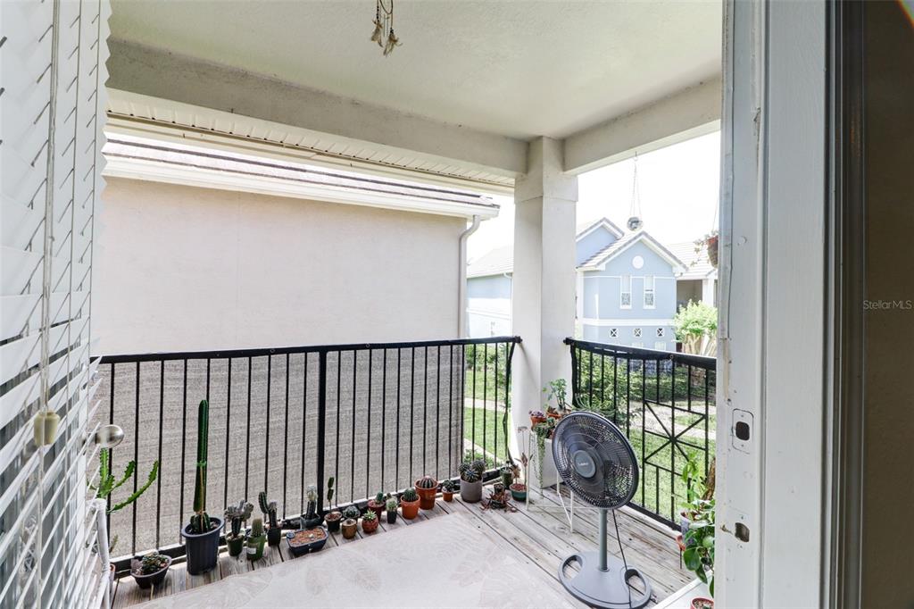 4004 Foxtail Palm Court, Unit 4004 Tampa, FL 33624 - Photo 26 of 49 a view of a porch with wooden floor