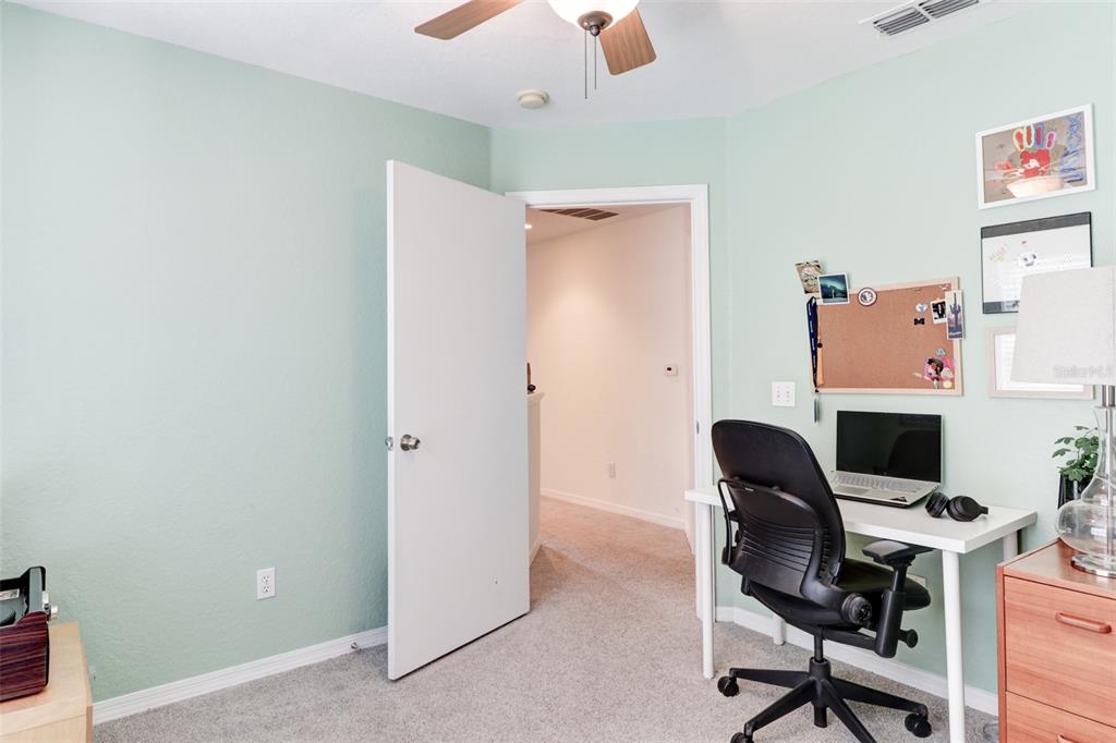4004 Foxtail Palm Court, Unit 4004 Tampa, FL 33624 - Photo 30 of 49 a work room with furniture and a chair