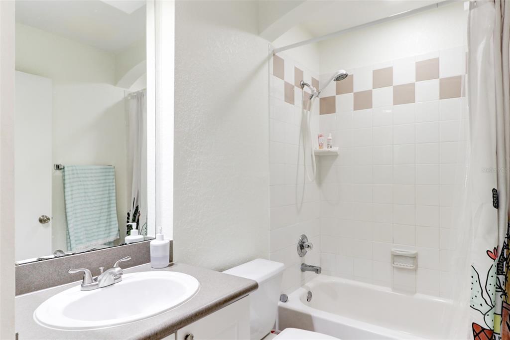 4004 Foxtail Palm Court, Unit 4004 Tampa, FL 33624 - Photo 31 of 49 a bathroom with a sink toilet and shower