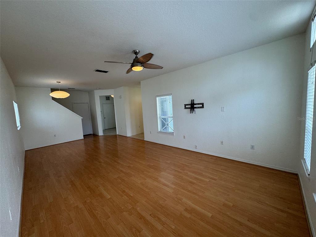 4004 Foxtail Palm Court, Unit 4004 Tampa, FL 33624 - Photo 8 of 49 a view of empty room with wooden floor
