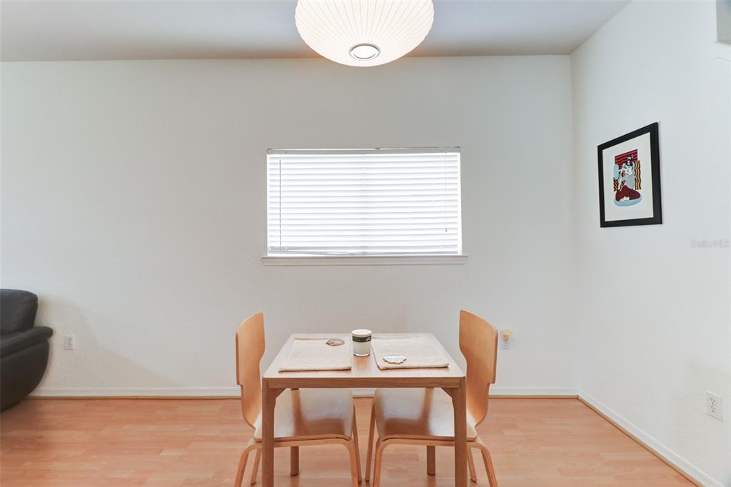 4004 Foxtail Palm Court, Unit 4004 Tampa, FL 33624 - Photo 10 of 49 a dining room with furniture and window