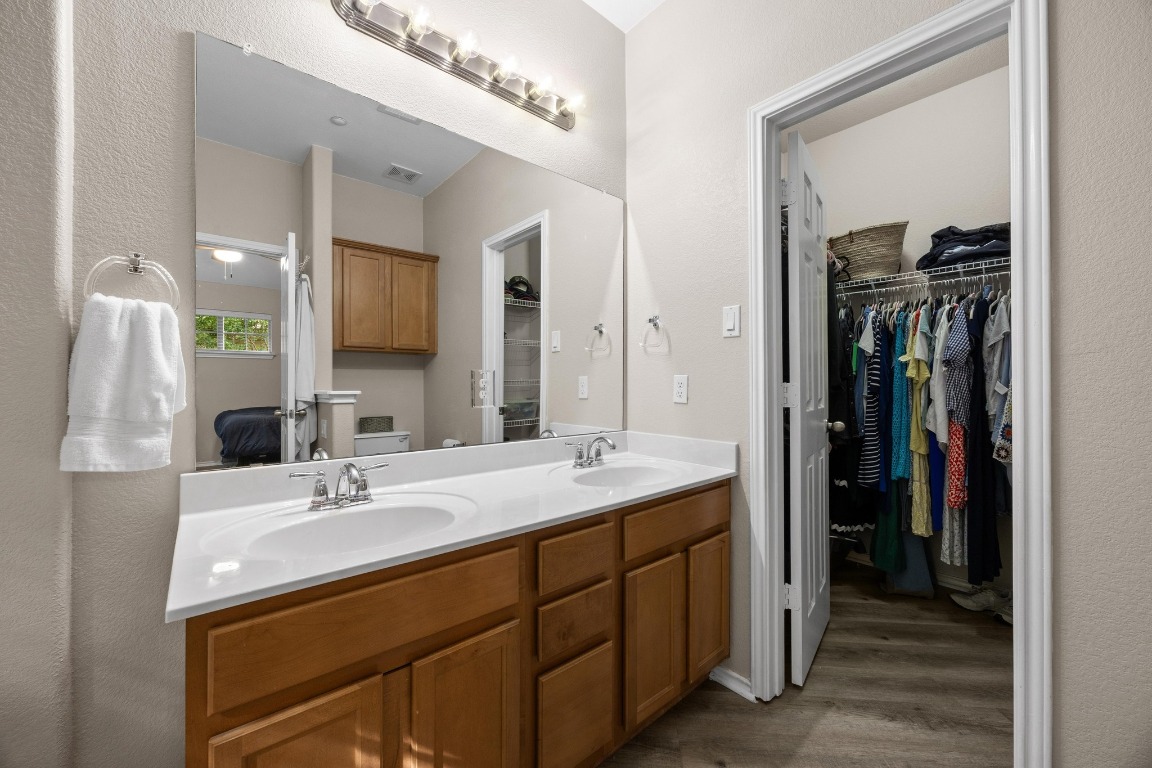 1310 West Parmer Lane, Unit 9B Austin, TX 78727 - Photo 21 of 38 a bathroom with a sink double vanity and a mirror