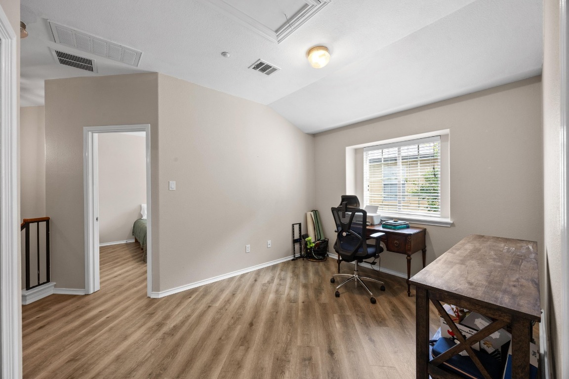1310 West Parmer Lane, Unit 9B Austin, TX 78727 - Photo 23 of 38 a workspace with wooden floor