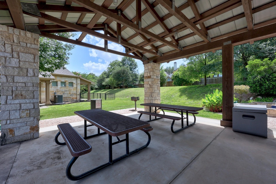 1310 West Parmer Lane, Unit 9B Austin, TX 78727 - Photo 28 of 38 a view of a patio with a table chairs and a yard