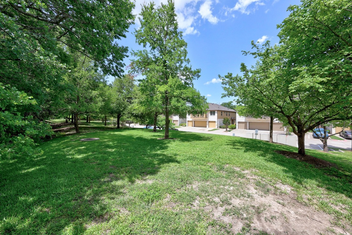 1310 West Parmer Lane, Unit 9B Austin, TX 78727 - Photo 35 of 38 a view of outdoor space with deck and garden