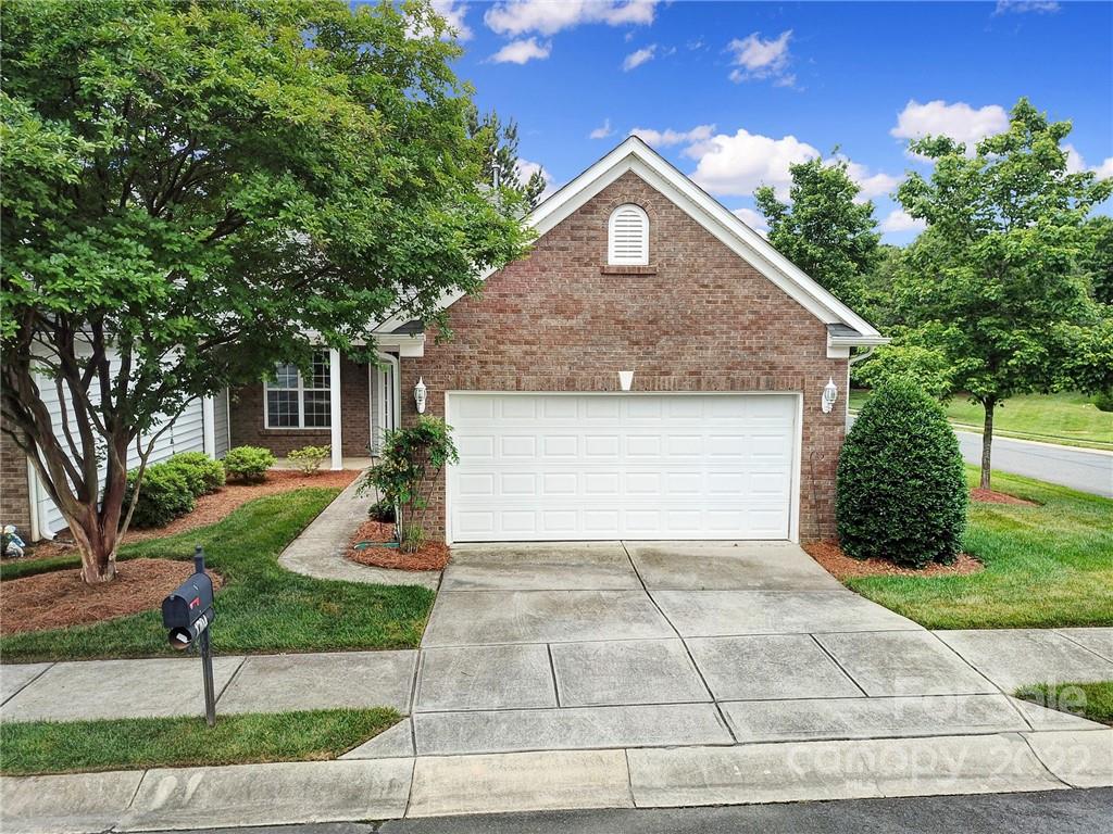 1704 Quartz Lane Fort Mill, SC 29708 - Photo 1 of 39 a front view of a house with garden