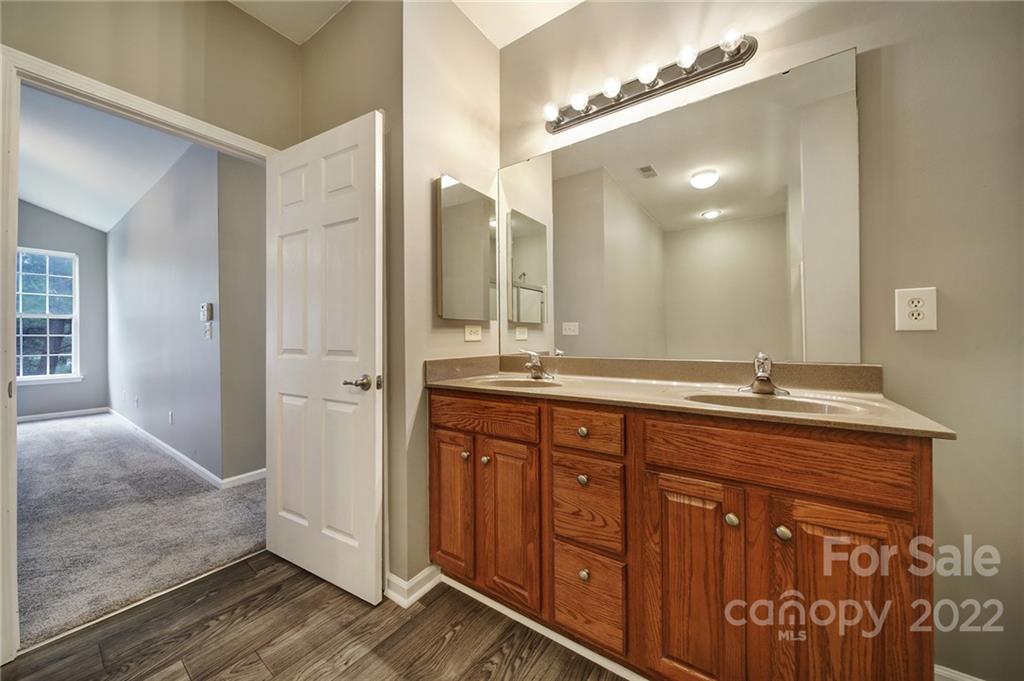 1704 Quartz Lane Fort Mill, SC 29708 - Photo 16 of 39 a spacious bathroom with a granite countertop sink a mirror and a shower