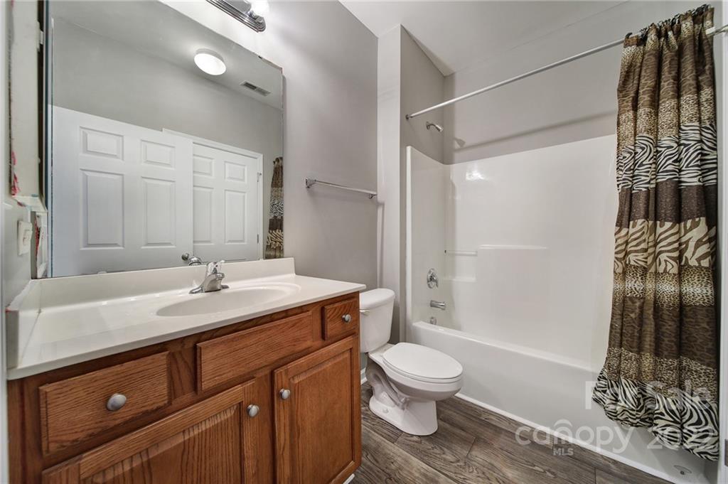 1704 Quartz Lane Fort Mill, SC 29708 - Photo 21 of 39 a bathroom with a sink toilet a mirror and shower