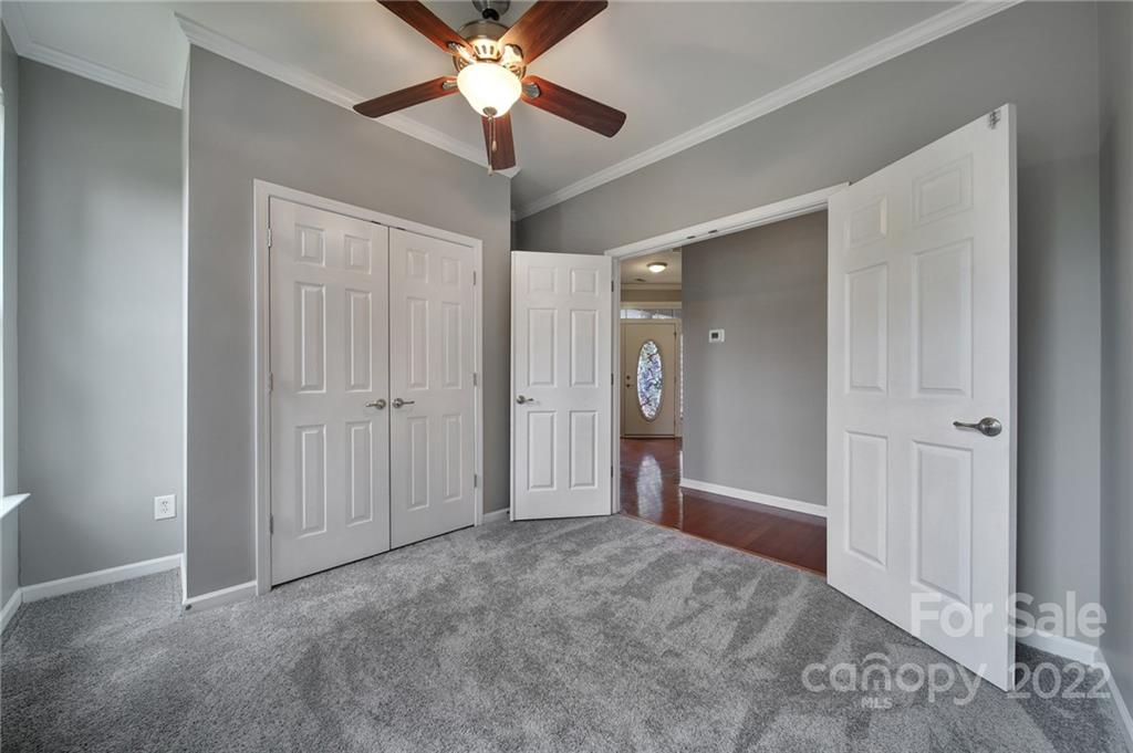 1704 Quartz Lane Fort Mill, SC 29708 - Photo 22 of 39 an empty room with closet and a ceiling fan