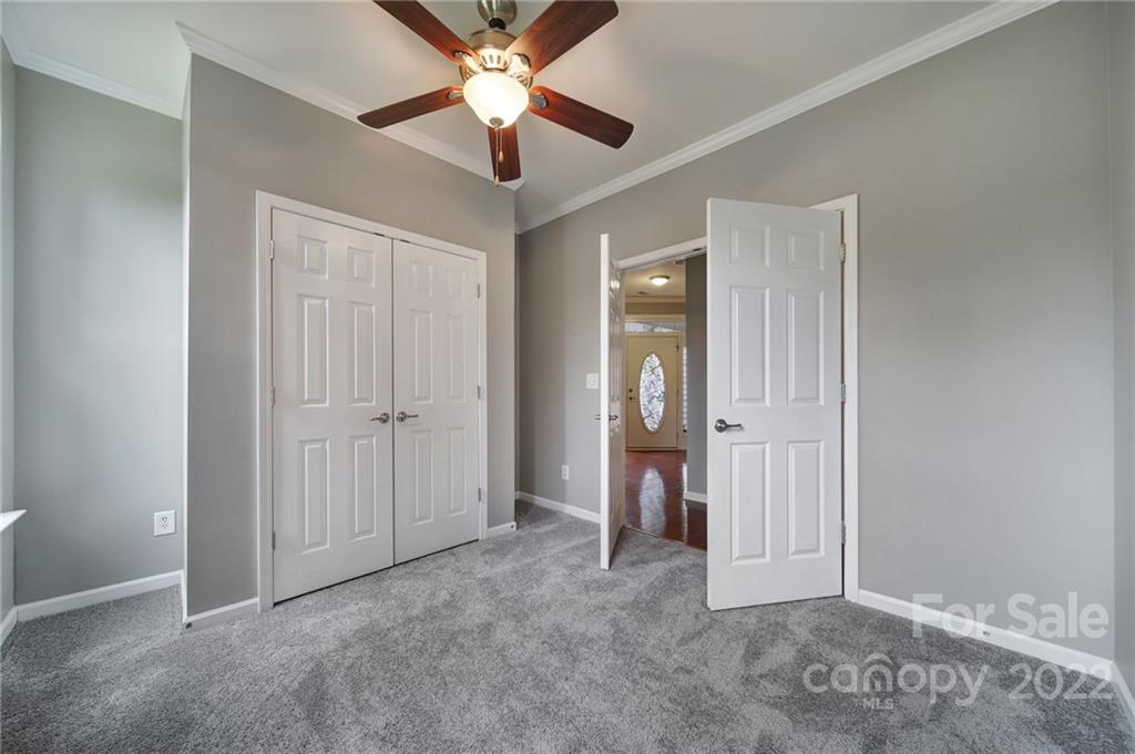 1704 Quartz Lane Fort Mill, SC 29708 - Photo 24 of 39 an empty room with closet and a ceiling fan