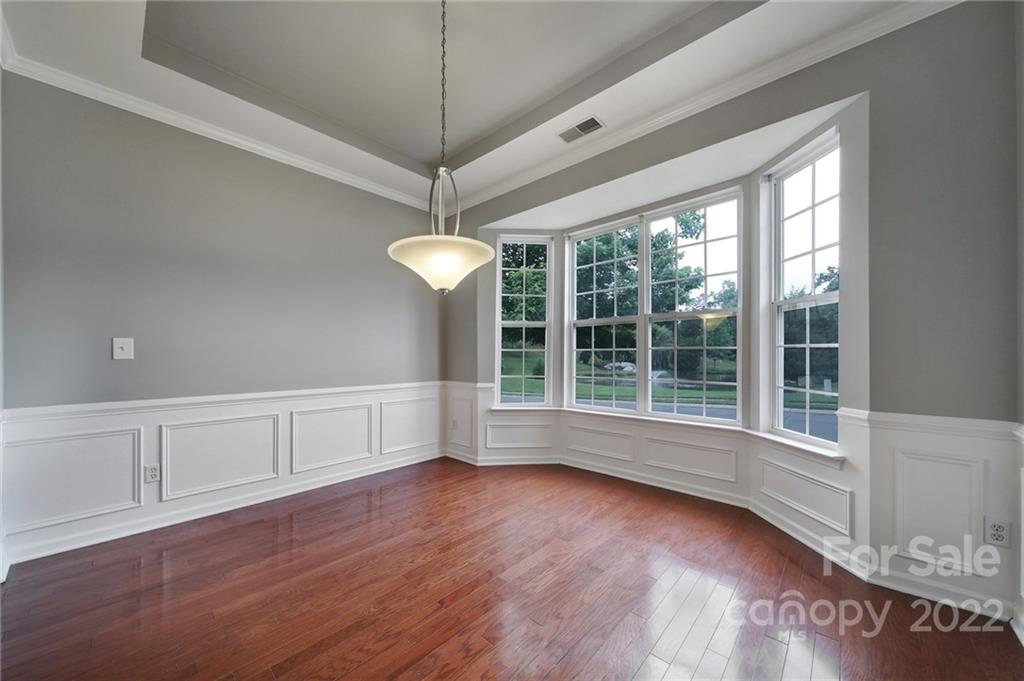 1704 Quartz Lane Fort Mill, SC 29708 - Photo 3 of 39 a view of an empty room with wooden floor and a window