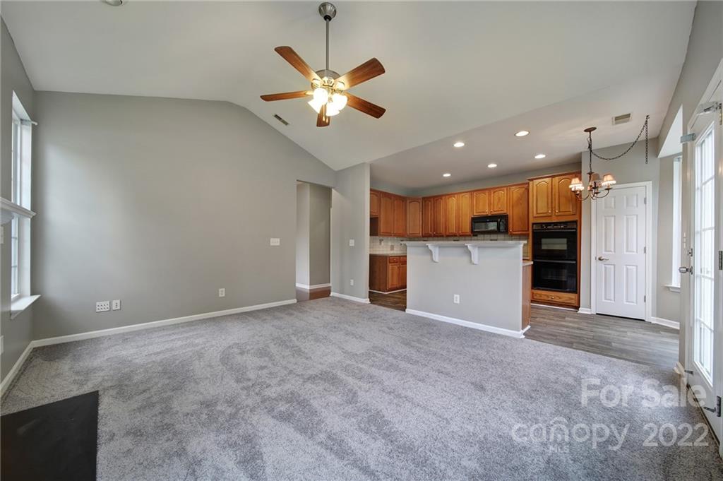 1704 Quartz Lane Fort Mill, SC 29708 - Photo 6 of 39 a view of a kitchen with a microwave and a refrigerator