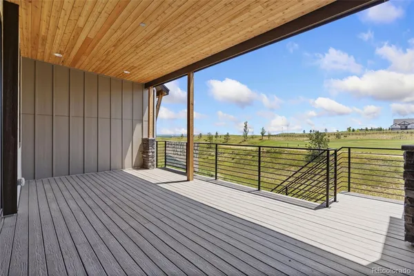 a view of outdoor space with wooden floor