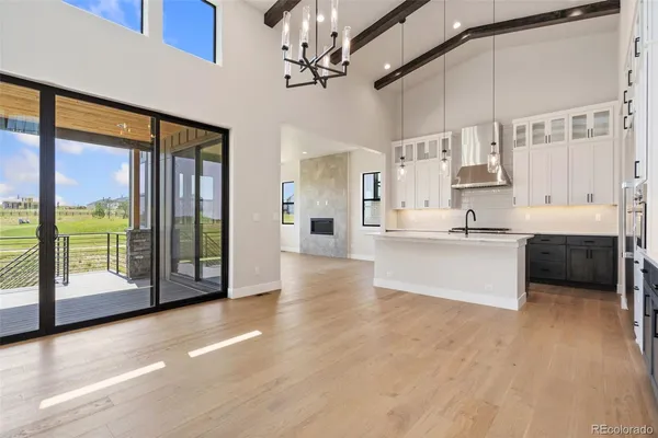 a view of large kitchen with stainless steel appliances cabinets and a floor to ceiling window