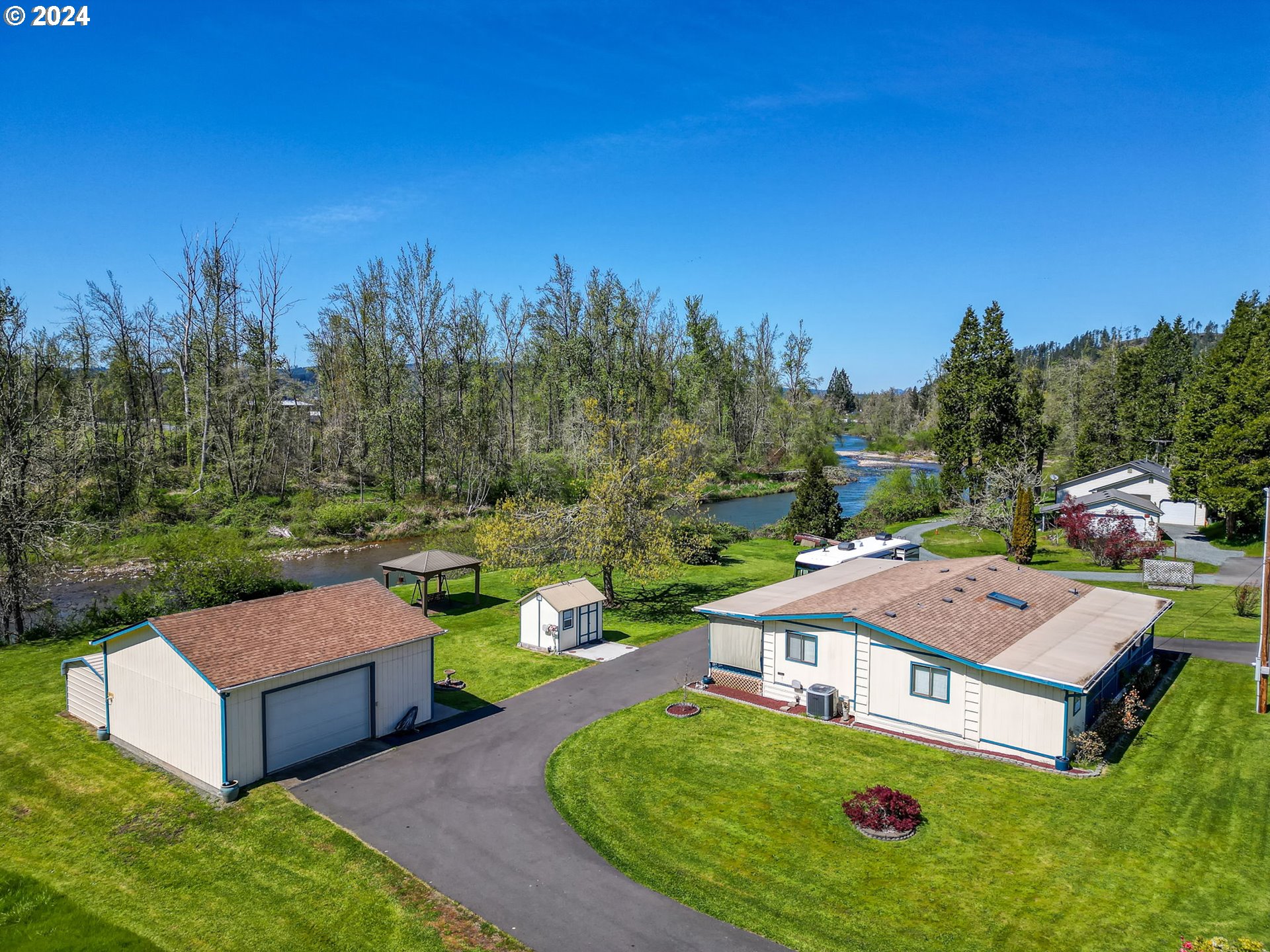78414 Sears Road Cottage Grove, OR 97424 - Photo 1 of 44 a view of a house with patio and a yard