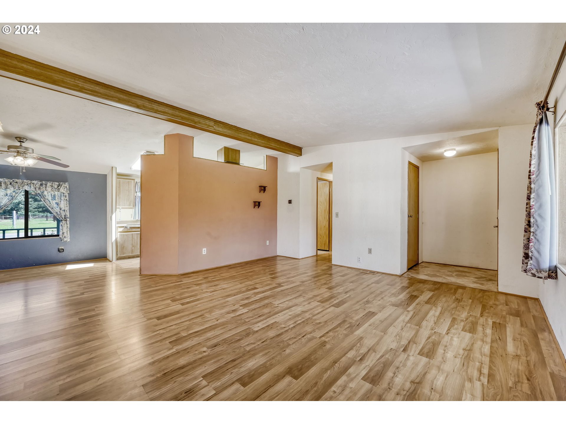 78414 Sears Road Cottage Grove, OR 97424 - Photo 11 of 44 a view of an empty room and wooden floor