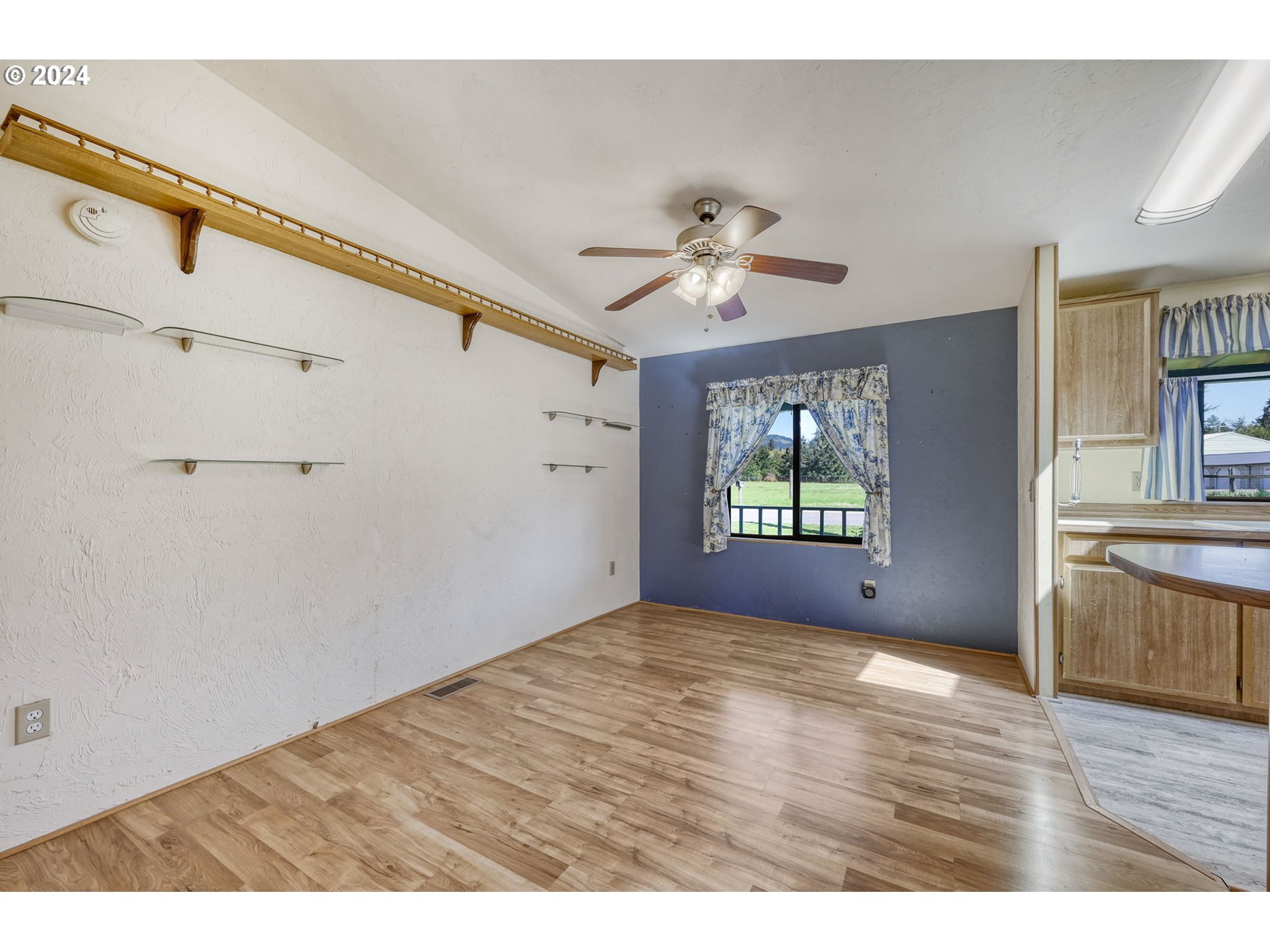 78414 Sears Road Cottage Grove, OR 97424 - Photo 18 of 44 a view of empty room with wooden floor and fan