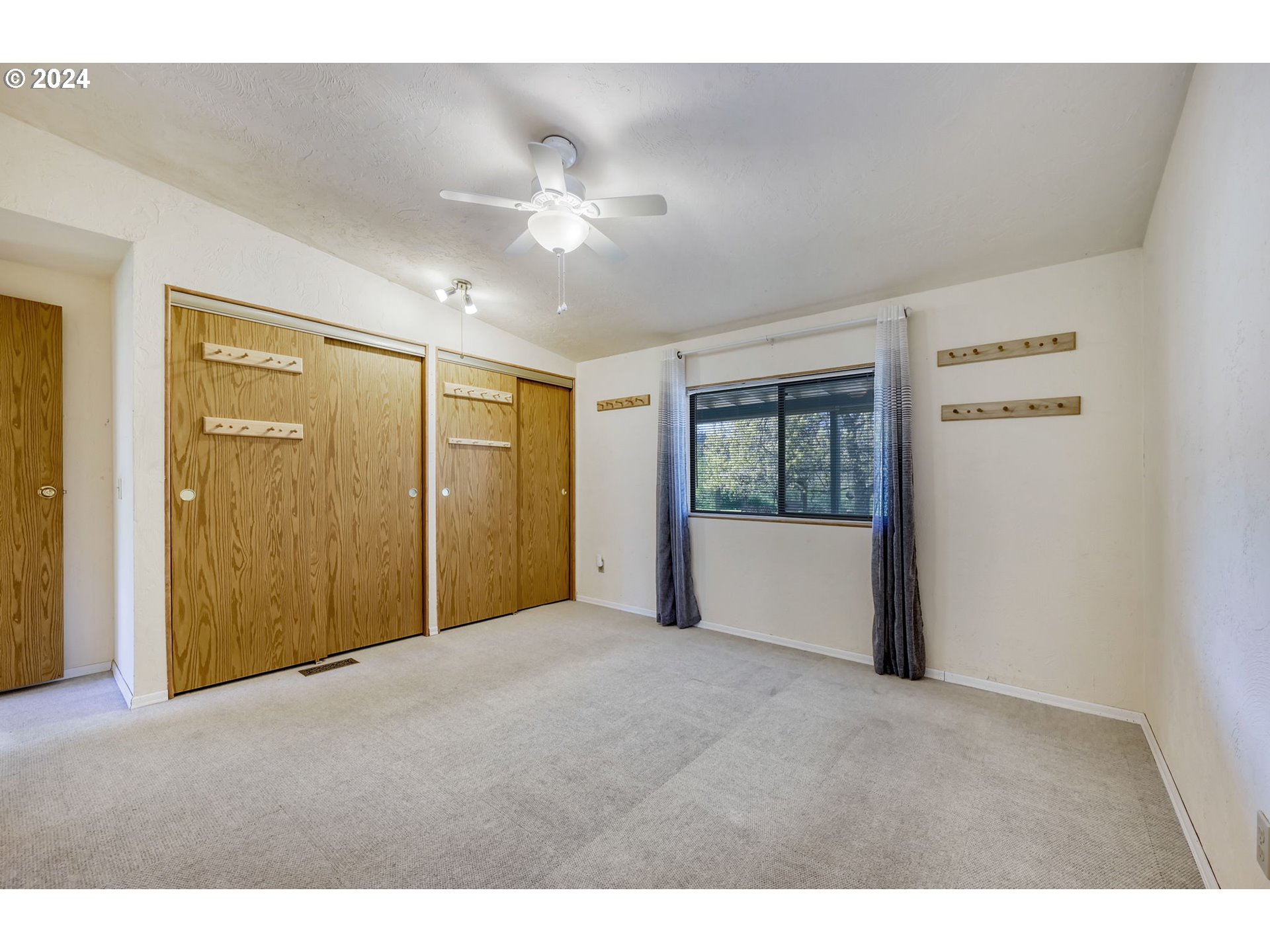78414 Sears Road Cottage Grove, OR 97424 - Photo 20 of 44 a view of an empty room with a window